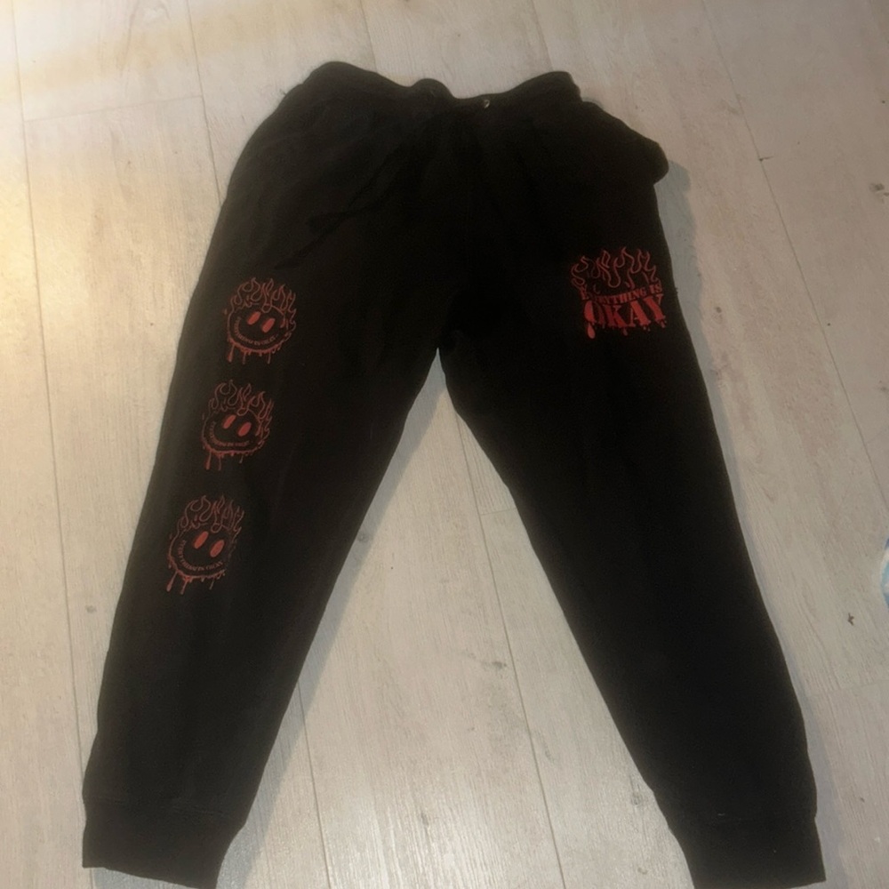 black pants with red detail